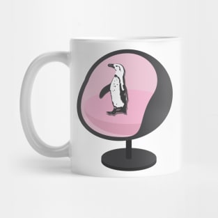 African Penguin Sitting on a Pink Egg Chair Mug